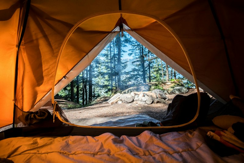 Large Class A RV at night camp